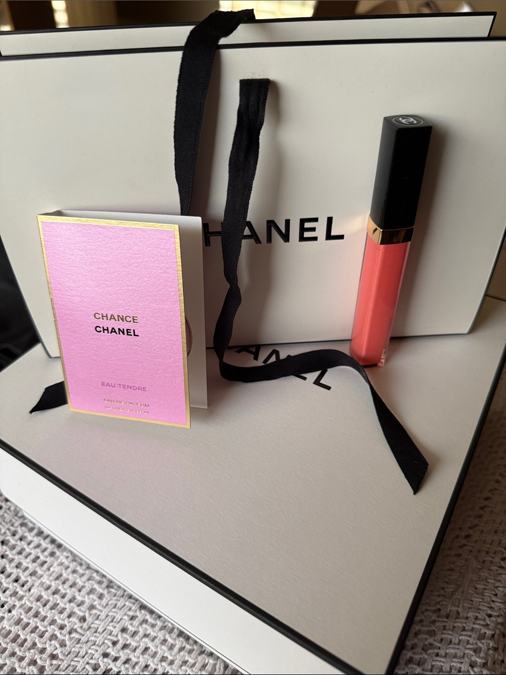 CHANEL Coral Pink Lip Gloss in Chanel bag with fragrance sample in Chance